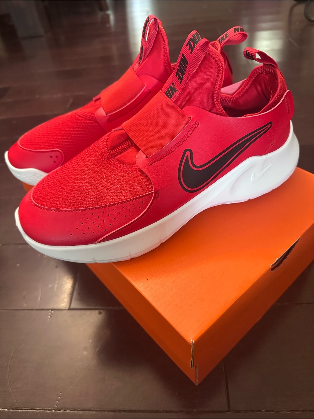 Nike Kids Red Slip-On Sneakers with Black Swoosh and White Sole